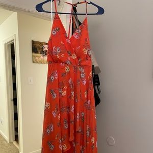 It’s a dark orange floral maxi dress.